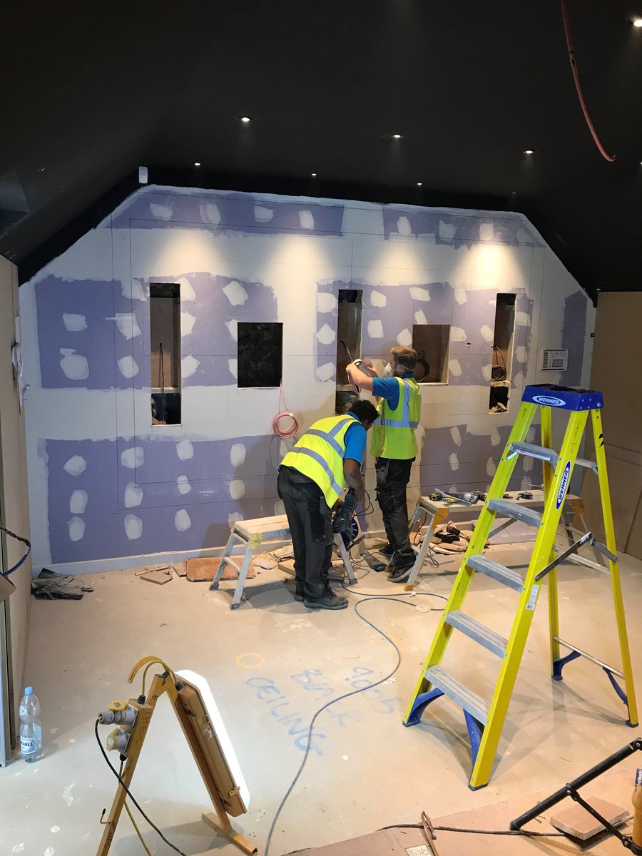 Gibson_Int's tweet photo. Our guys cutting in the LCR speakers &amp; 2 x Subs into the screen wall in this 11 seat multi tier cinema, featuring 7.2.4 Dolby Atmos sound. Screen wall now ready for fabric application. Let Gibson design &amp; build your dream cinema! #cinema #interiors #smarthome  #design #interiors https://t.co/e0fPoxSBAH