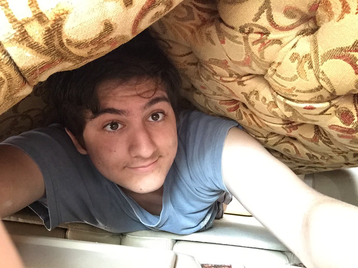 Picture of me underneath a couch in my mom’s car.