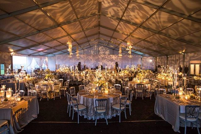 This tented reception made us of gobo lighting to create an interesting pattern on the cieling. || Planner: @mdurpettievents | Photographer: @davidturnerphoto | Cake: @elysiarootcakes | Venue: @chicagoparks | Catering: @paramountevents | Florals: @platinumevent || #PartySlat…