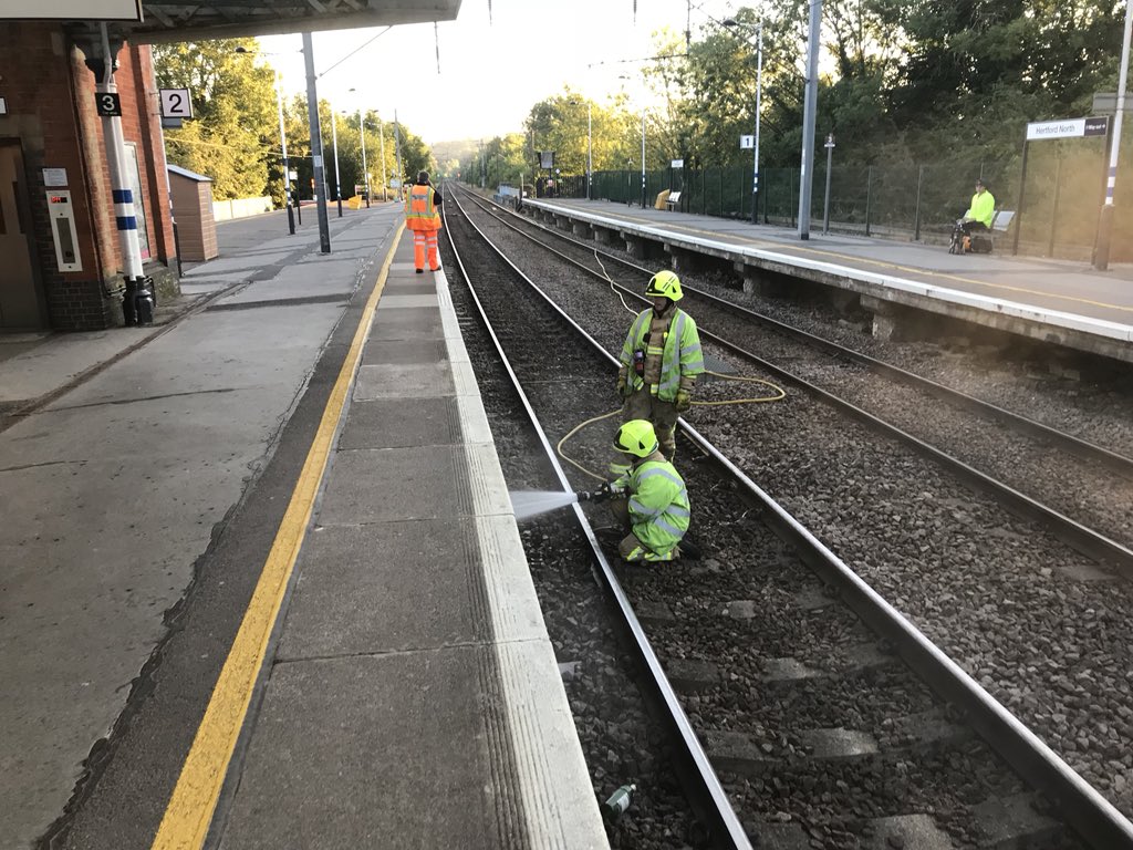 HertfordFireStn's tweet image. Red Watch @HertfordFireStn attended a small fire under the platform at Hertford North Train Station this morning with 3 additional railway sleepers also alight. Crews used an extended hose-reel and 'old school' hauling aloft techniques to gain access via rail bridge. #FireCraft