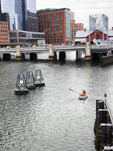 RisingWatersBOS's tweet photo. We were doing some routine maintenance of #risingwatersBOS over the weekend. In this picture, the orbs are floating high above the water level to illustrate the rising sea levels in Boston. #risingwatersboston #risingwaters @Fortpointarts https://t.co/WqxL6HHAdM