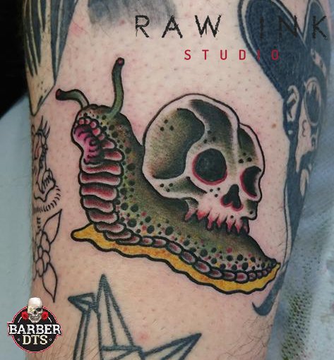 Arm Skull Snail Tattoo by Bloody Blue Tattoo