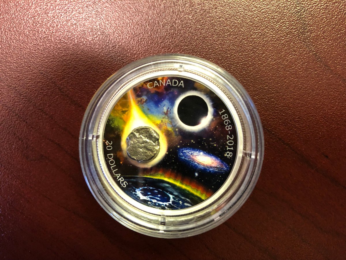 ChiefSciCan's tweet photo. Congratulations @RASC on your sesquicentennial commemorative coin! Its #meteorite fragment is a reminder that there is a lot more in the universe than what we see in our daily lives. Here’s to the next 150 years of inspiring curiosity and exploration! #RASC150 @CanadianMint https://t.co/W8EoofJymJ
