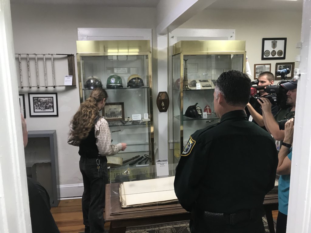 SeminoleSO's tweet photo. Sheriff Lemma is proud to present to Bennett Lloyd and the Museum of Seminole County History, a 1916 #SCSO badge, #6 discovered buried in the woods by a metal detecting enthusiast. Now the oldest badge in the museum’s collection! #WeAreSCSO. https://t.co/HuIzpceIiM
