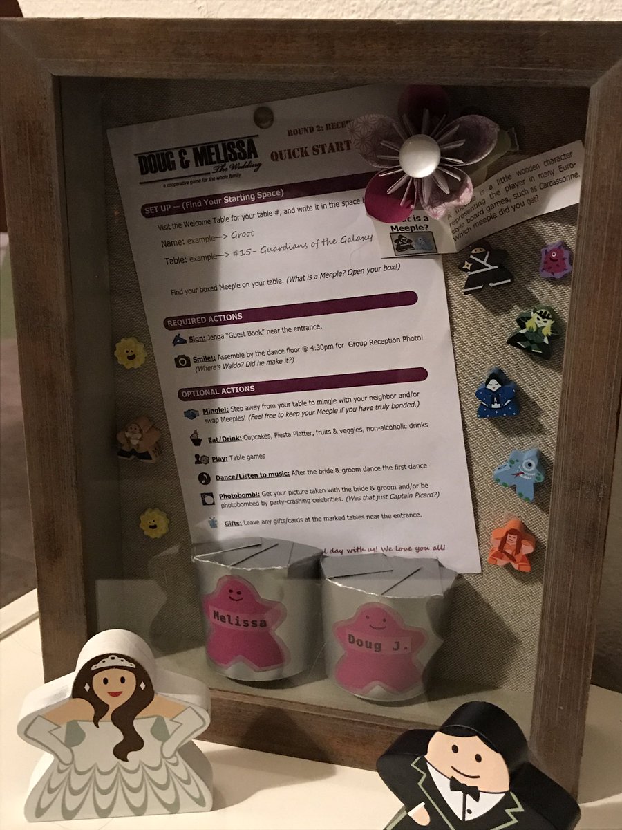 MAJankowski's tweet photo. It took me three years, but I finally put together a shadow box of my wedding reception (with a board game theme). I ❤️the meeples (and my hubby, of course!). #amgaming #amcrafting https://t.co/HPHtJRDCJ9