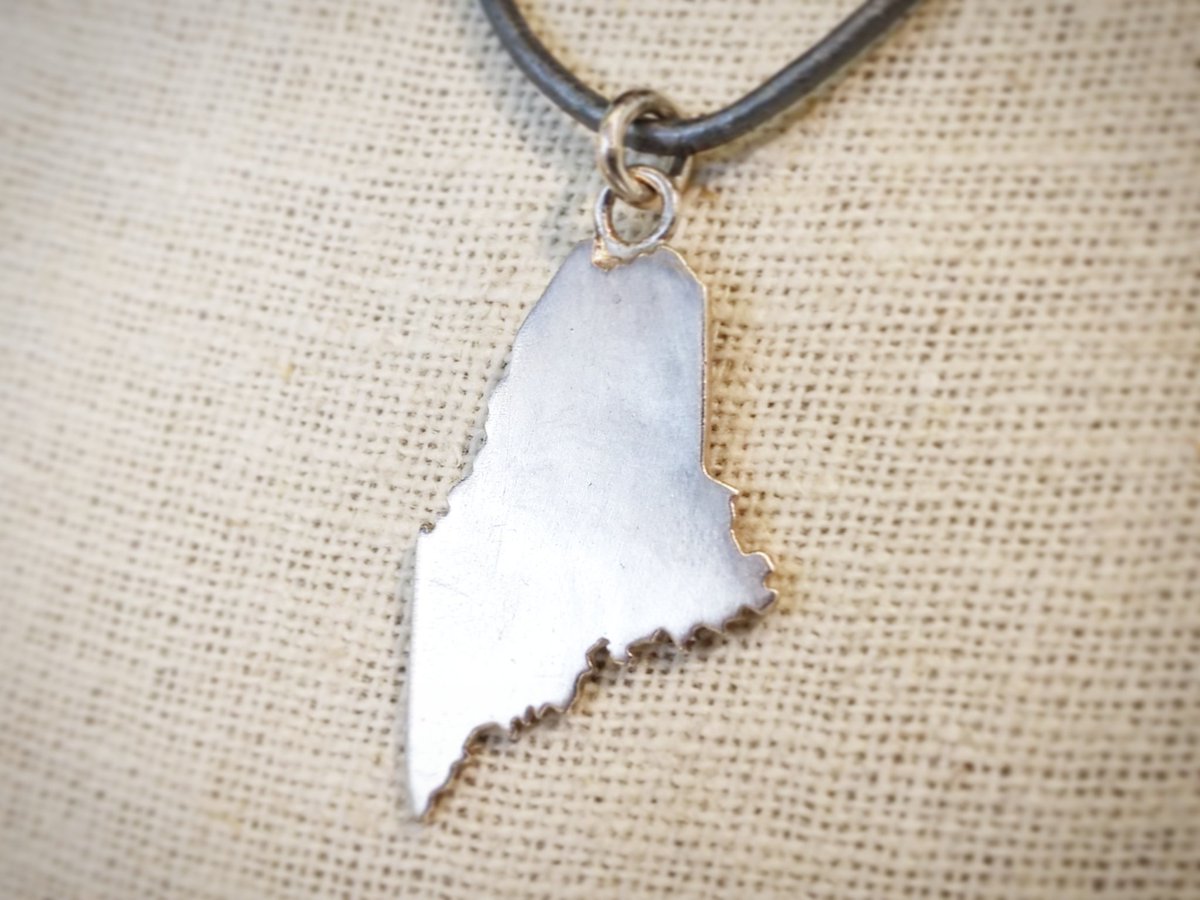 Is your heart in Maine? Then you need one of Elizabeth Prior's silver Maine necklaces.
.
.
.
.
#jewelery #silver #necklace #maine #mainelife #207 #mainetheway #onlyin207 #maineisgorgeous #mainething #maineinvitesyou  #portlandme #portlandmaine #oldport #forerivergallery