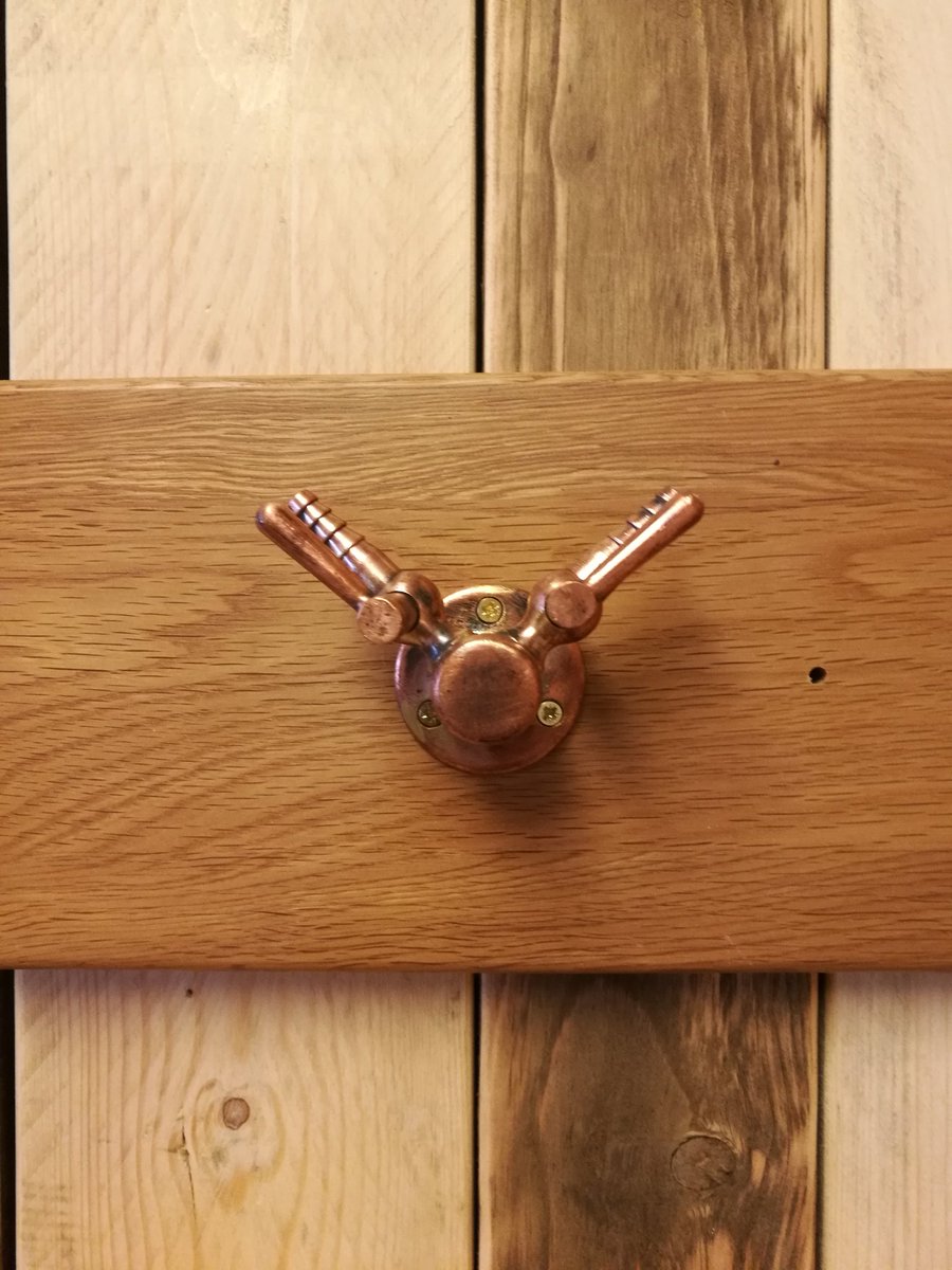 School science lab gas taps (polished) repurposed to become a pair of coat hooks. Fitted to a reclaimed oak kitchen drawer front #upcycled #reclaimedoak #reclaimedwood