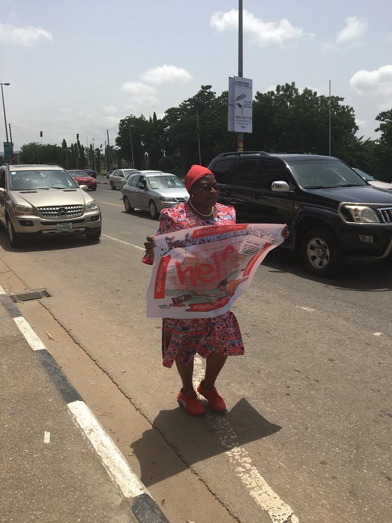 I MARCHED as far as I could to the Villa to protest the INEFFECTUAL WAYS of .⁦@NGRPresident⁩ ⁦@MBuhari⁩ on the #TerroristsHerdsmenKillings. 
Their Police, Military & SSS trampled on my rights- seized my banner. 
#StopTheKillings. 
#EndTheBloodFlow!
#PlateauMassacre .