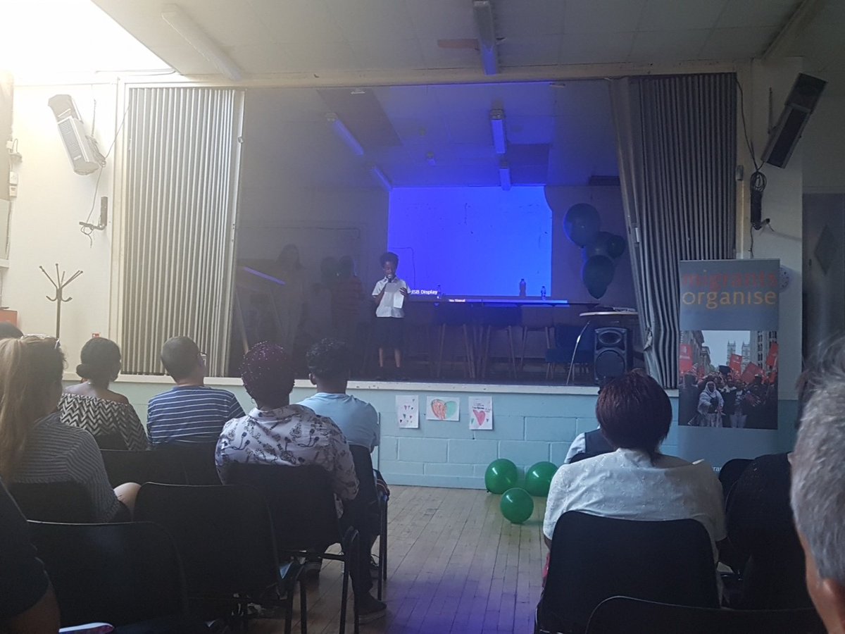 YMCAGWC's tweet image. Children and Young People of all ages sharing their hearts, thoughts and experiences through poetry at #HopeInUnity in the wake of #GrenfellTower showing how resilient and together the #NorthKensington community are and continue to be @migrantsorg @gatetheatre #GreenForGrenfell