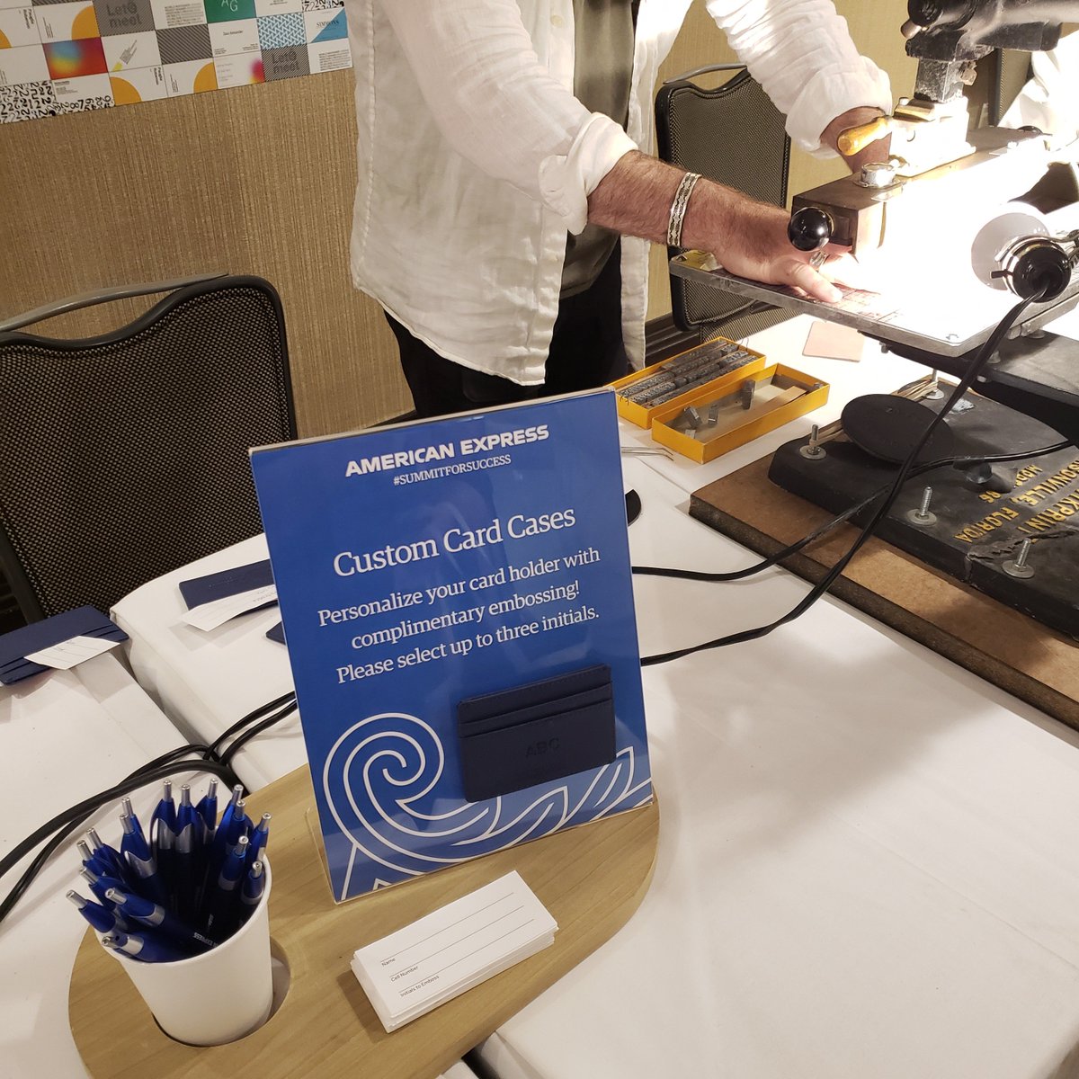 AmexBusiness's tweet image. Another must-do at the #SummitForSuccess: complimentary embossing! Personalize a Business Card case with your initials before you go.