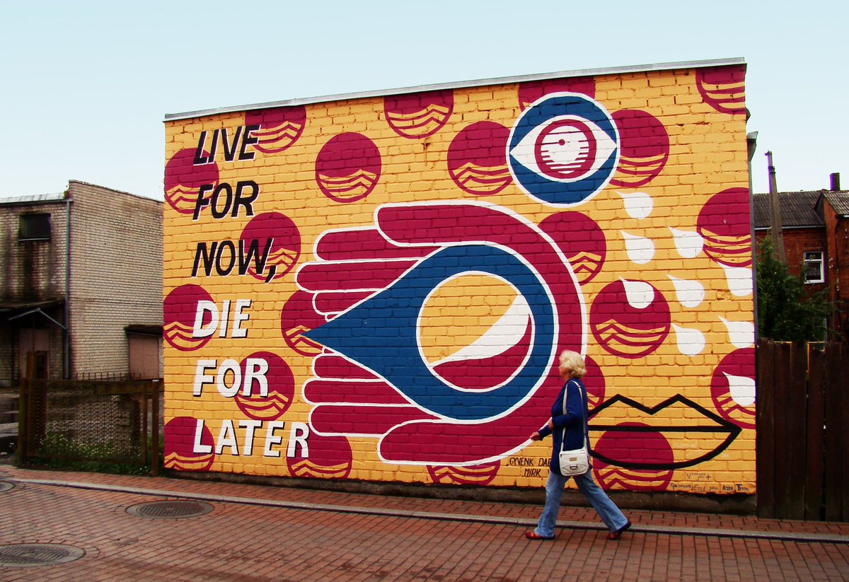 MalonnyArt's tweet photo. "Live for now, die for later" by Vandana Jain, done in 2015 during the 2nd #Malonny. You might notice a few well known corporational logos, and two palms holding a drop of water, both of which make up a contrast of life and death. #StreetArt https://t.co/Nq6E3HngfZ