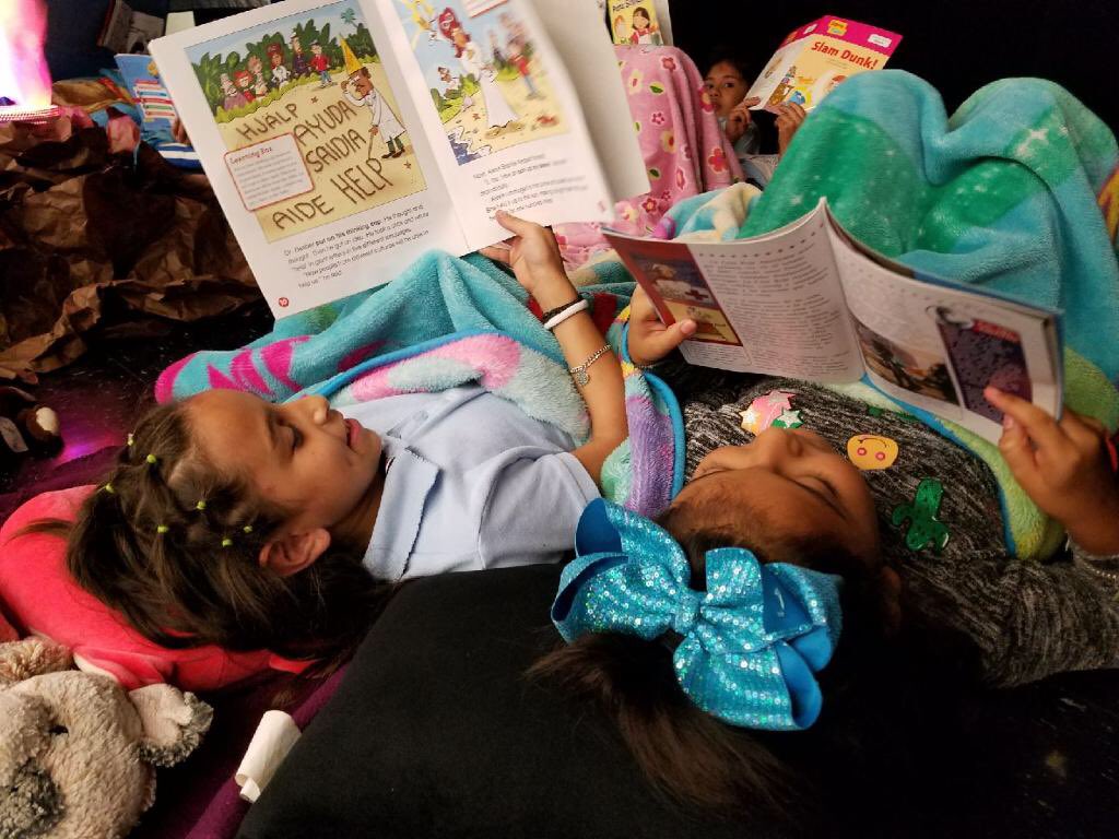 Deanda_HISD's tweet photo. Summer Camp DeAnda is in full swing! Our campers love reading fireside! (Don’t worry! The fire isn’t real!) https://t.co/TDLryPBPeL