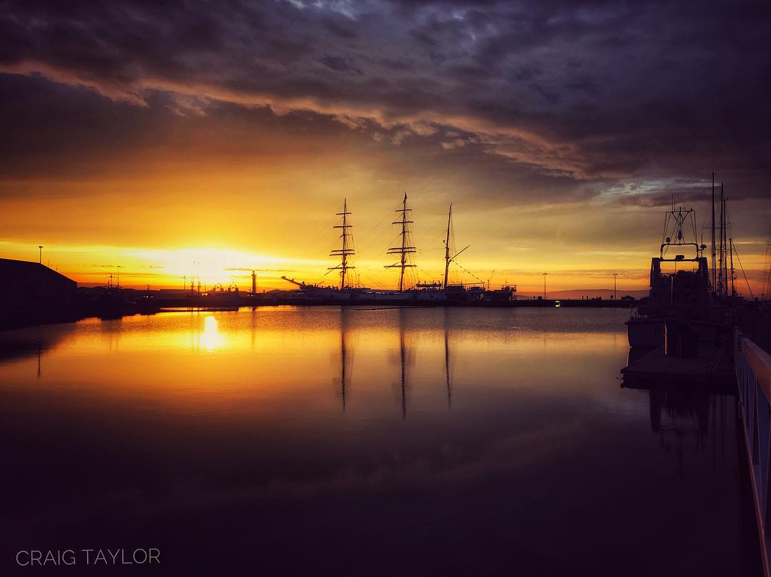 Tall ship Statsraad Lehmkuhl in Kirkwall harbour at sunset