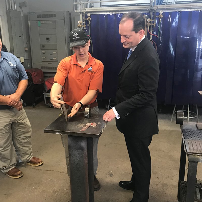 U.S. Secretary of Labor Alexander Acosta talking with a carpenter apprentice at the Southern Illinois Carpenters Joint Apprenticeship Program.