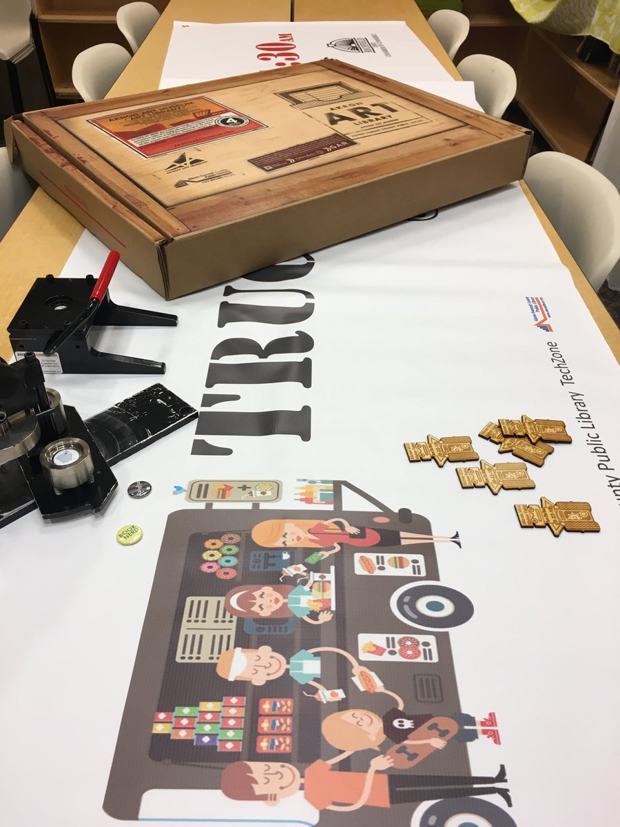 Richfieldbranch's tweet image. I went to @akronlibrary and all I got was: art from @AkronArtMuseum for us, a #buttonmaker &amp;amp; 11ft banner from #TechZone #vinylcutter for programs and really cute promo pieces for #AkronMakerFaire of wooden robots #laserengraver #TechZone