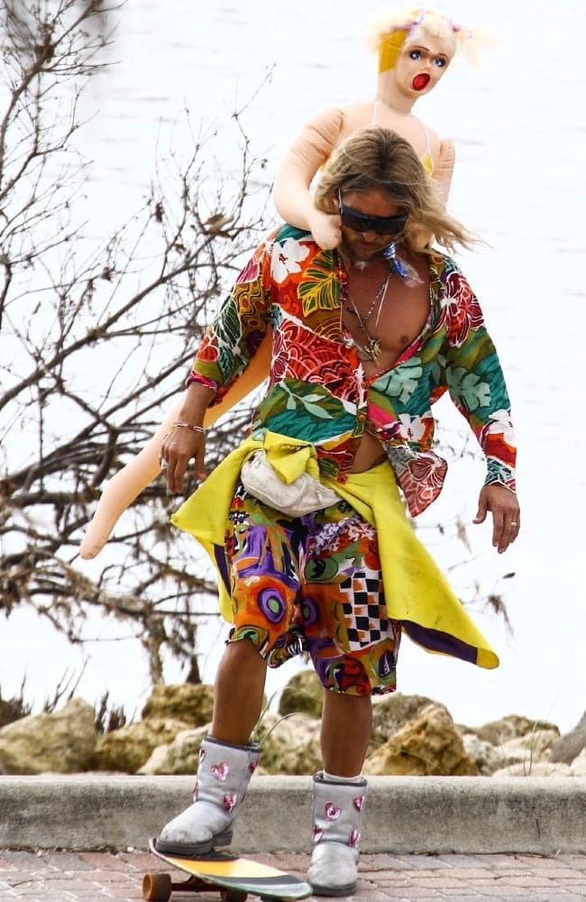 good news: this photo of Matthew McConaughey—wearing uggs with sequined  hearts and a sex doll for Harmony Korine's BEACH BUM—exists