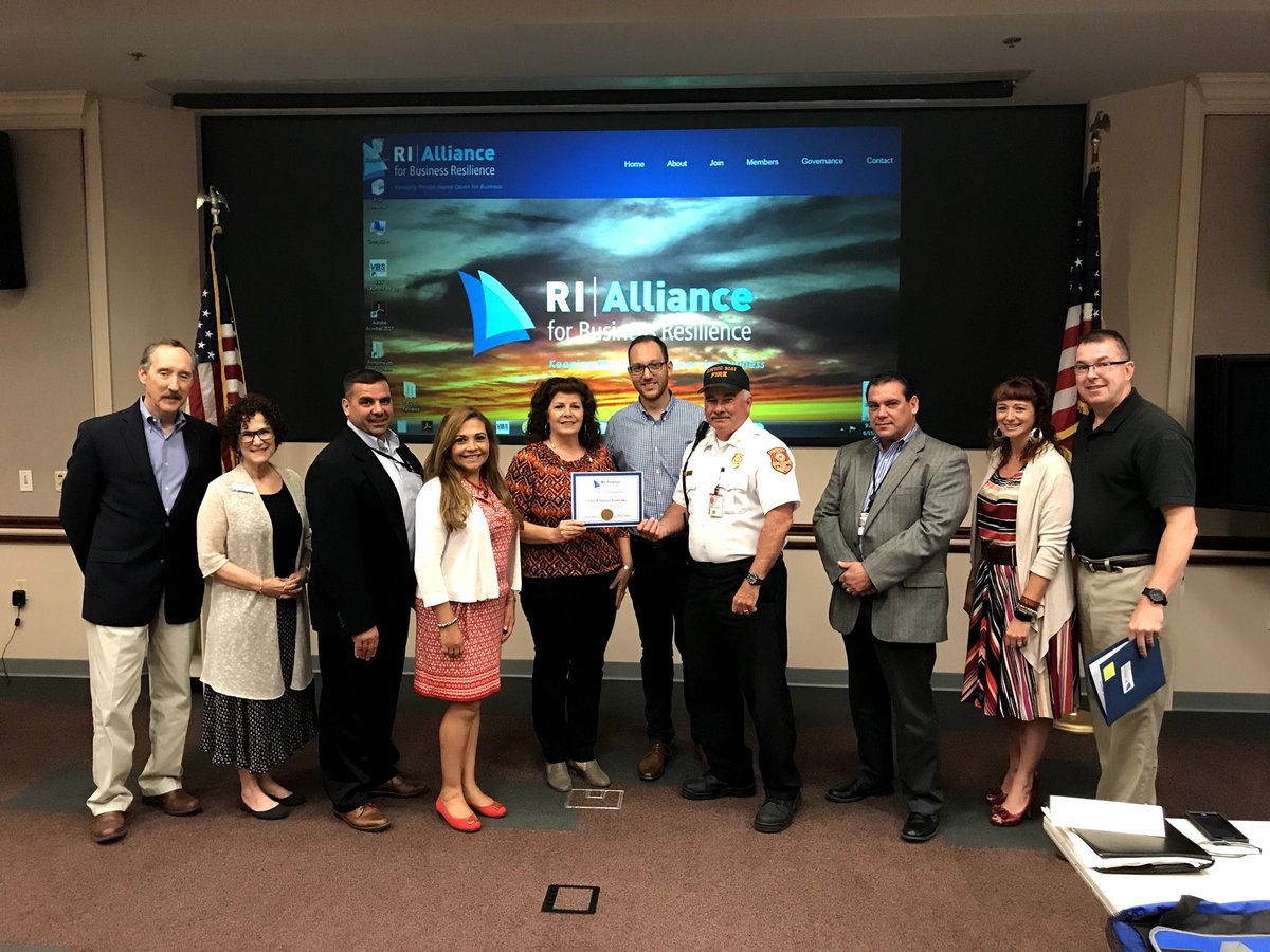 Membership in The Alliance has tripled in one year! Here, Lori Adamo of United Natural Foods Inc. (UNFI) gets her Alliance member certificate. Her business is one of five to have joined at the last meeting. Congratulations!