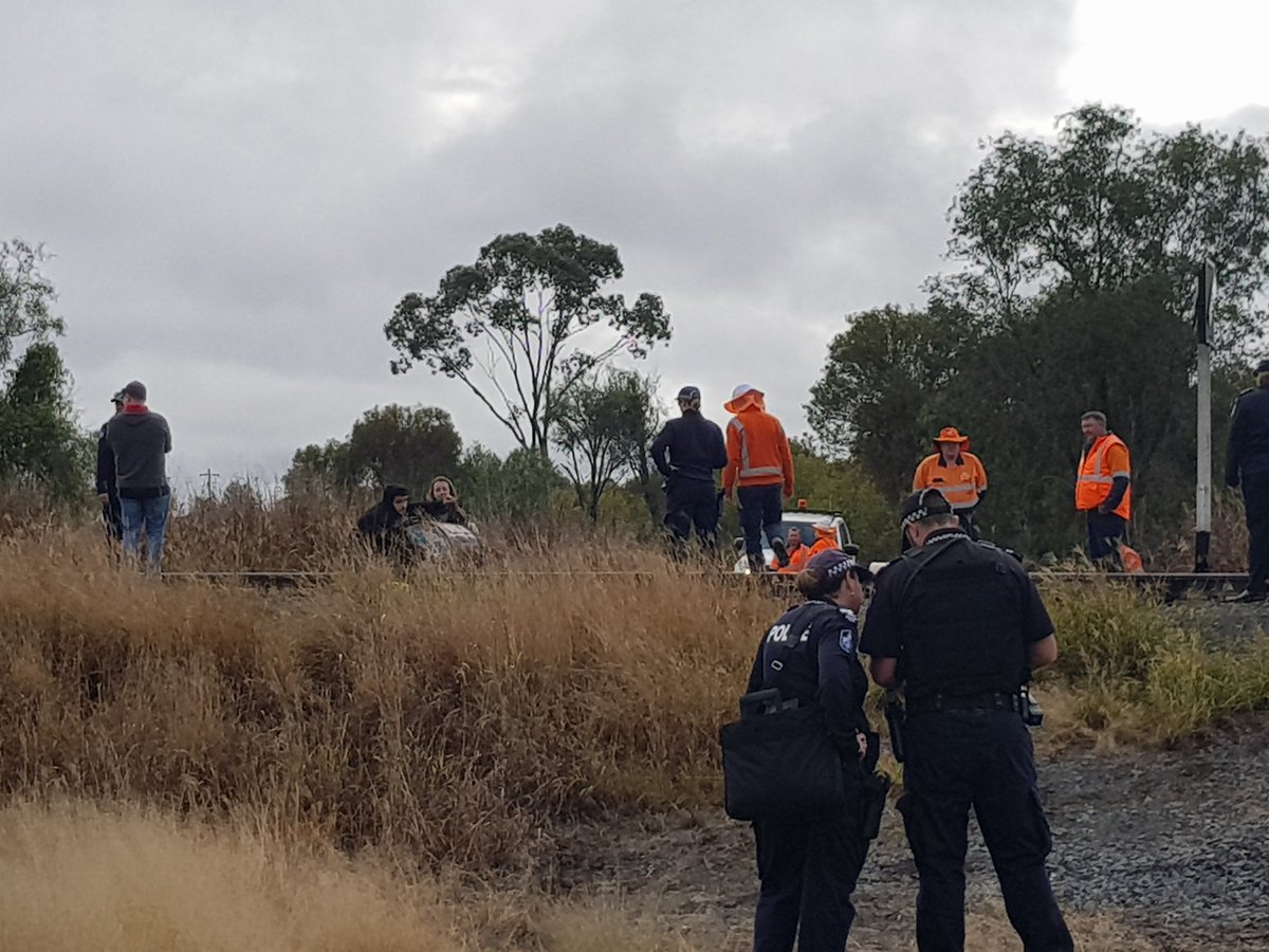 ashleyrporter's tweet photo. Two activists have chained themselves to the rail line at Jondaryan, protesting against new coal and the Acland Mine expansion. Report on @7NewsToowoomba at 6pm. #7News https://t.co/0lP7Jyds2W