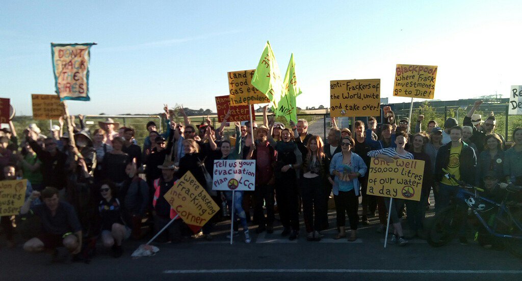 reclaimthepower's tweet photo. 6.20am: Around 150 people are stood across the gates of Cuadrilla's unwanted fracking site at Preston New Road, Lancashire for the start of #BlockAroundTheClock. Come on down! https://t.co/zJhakdUpAL https://t.co/rReDcYvRBm