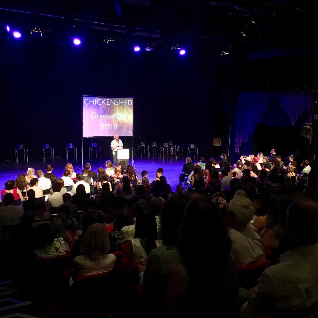 Chickenshed_Edu's tweet image. After an energy-filled opening from our first year BTEC students, @CHICKENSHED_UK artistic director @SteinLou takes to the stage for a speech #CSgrad #graduation2018