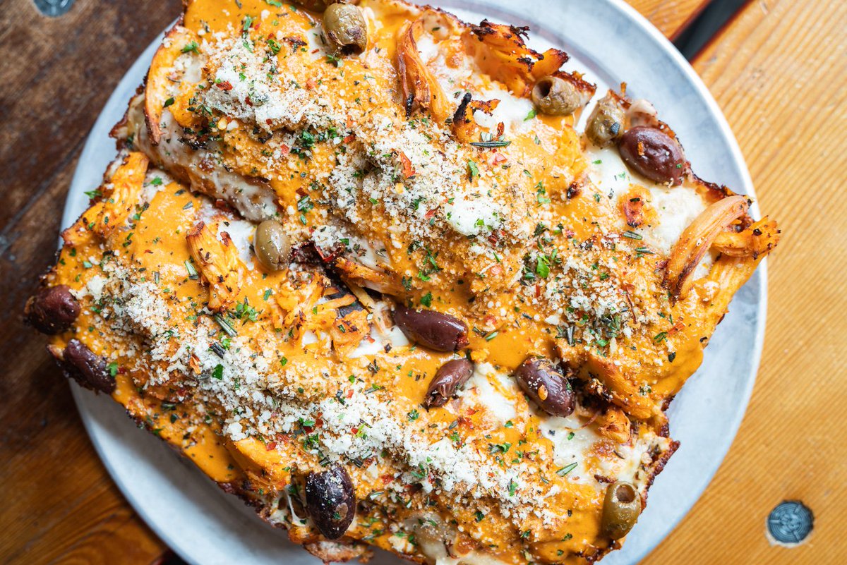 SmallmanGalley's tweet photo. With Boyd &amp; Blair vodka sauce, braised chicken thigh, marinated olives, and panko herb crumble, it’s easy to see why the Vodka Pie from @IronBornPgh is bound to be your new favorite! https://t.co/ohFs9UlJHs