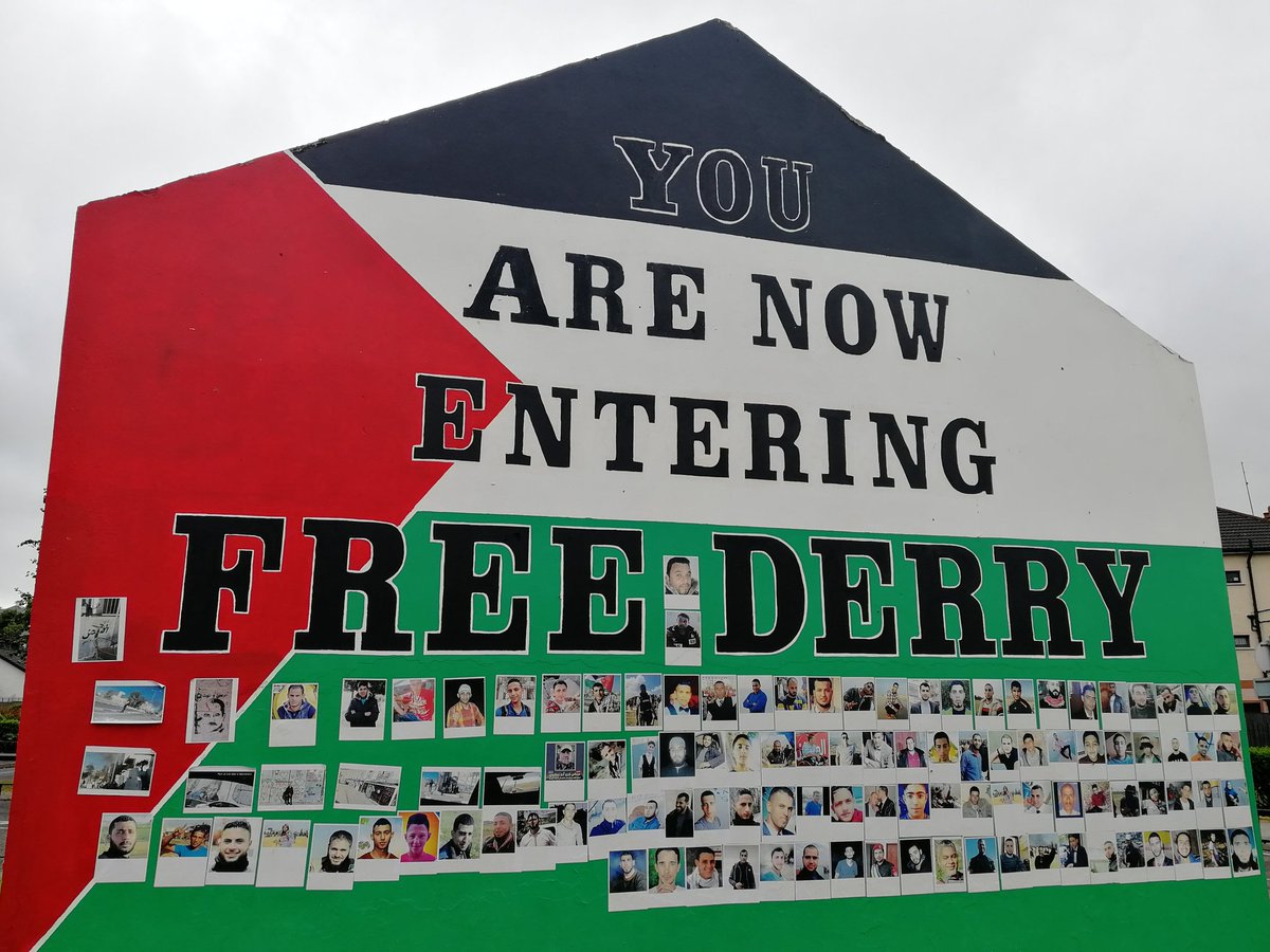 Free Derry Corner is dedicated to Palestine at the moment,plastered with  the faces of those recently killed including photojournalist Yaser Murtaja, image size:1200x900