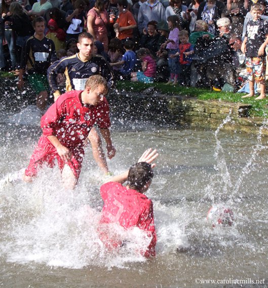 SlowCotswolds's tweet photo. If you couldn't get tickets for tonight's #WorldCup match, the #Cotswolds has its very own world-renowned and quirky annual #Football in the River match, held #bankholiday August in Bourton-on-the-Water. Prepare to get wet! #EnglandvCroatia #ENGCRO #WaistcoatWednesday #England https://t.co/wQK6eBUDUw
