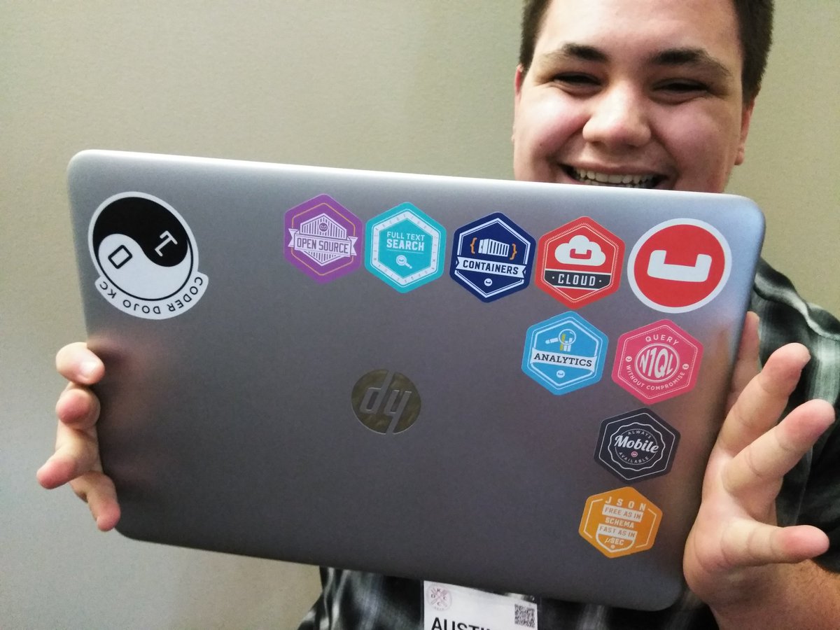 mgroves's tweet image. #kcdc likes the new #couchbase stickers!