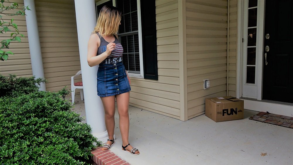HeroineUniverse's tweet photo. Patriot Girl (in her civi's) returning home after a long-day of fighting crime. Oh, what's that? A not-at-all-suspicious-looking box labeled "fun" sitting by her door? She should probably just open it. Nothing bad could possibly happen. It's labeled fun, after all. #CustomEditing https://t.co/7c2Vua2jG0