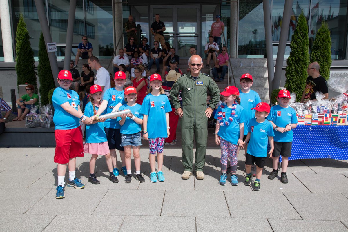 The #RAF100 Baton's international journey included a visit to <a href="/NATO/">NATO</a> HQ Allied Air Command. It was presented by UK children to Air Marshal Stuart Evans, Deputy Commander AIRCOM after a 5km #RAFBatonRelay from the UK School in Ramstein, Germany as part of HQ AIRCOM's Families Day.