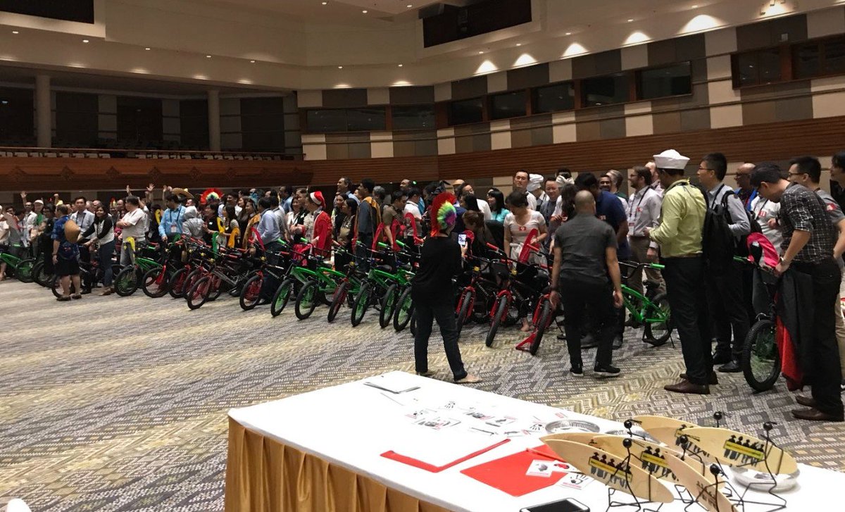 RedHatAPAC's tweet photo. #RedHatPC partners and associates build bicycles for the underprivileged and disabled children of Puspadi Bali, a local NGO supporting the rehabilitation, education and empowerment. Great team work! Stronger Together! https://t.co/isZBic3S1N
