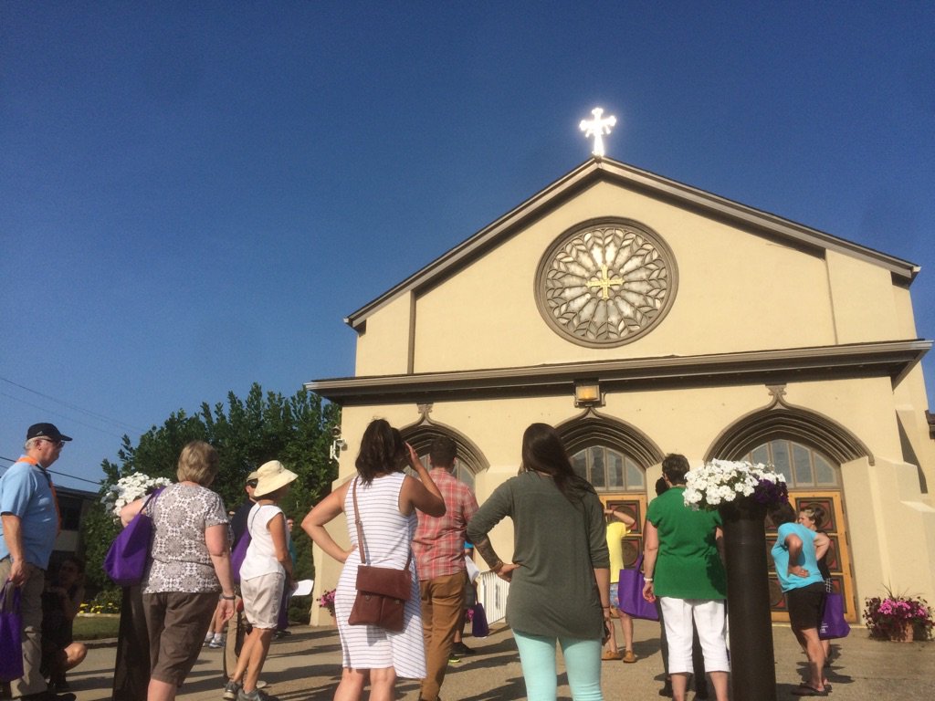 Akron2Akron's tweet photo. Scene from last evening’s walking tour of Akron. Annunciation of Mary accommodated Irish and Eastern European Catholics during the early 1900s. It’s in the style of an Italian countryside church and the inside is in the Romanesque style. Women of the Bible adorn the doors. https://t.co/joXysVqA3i