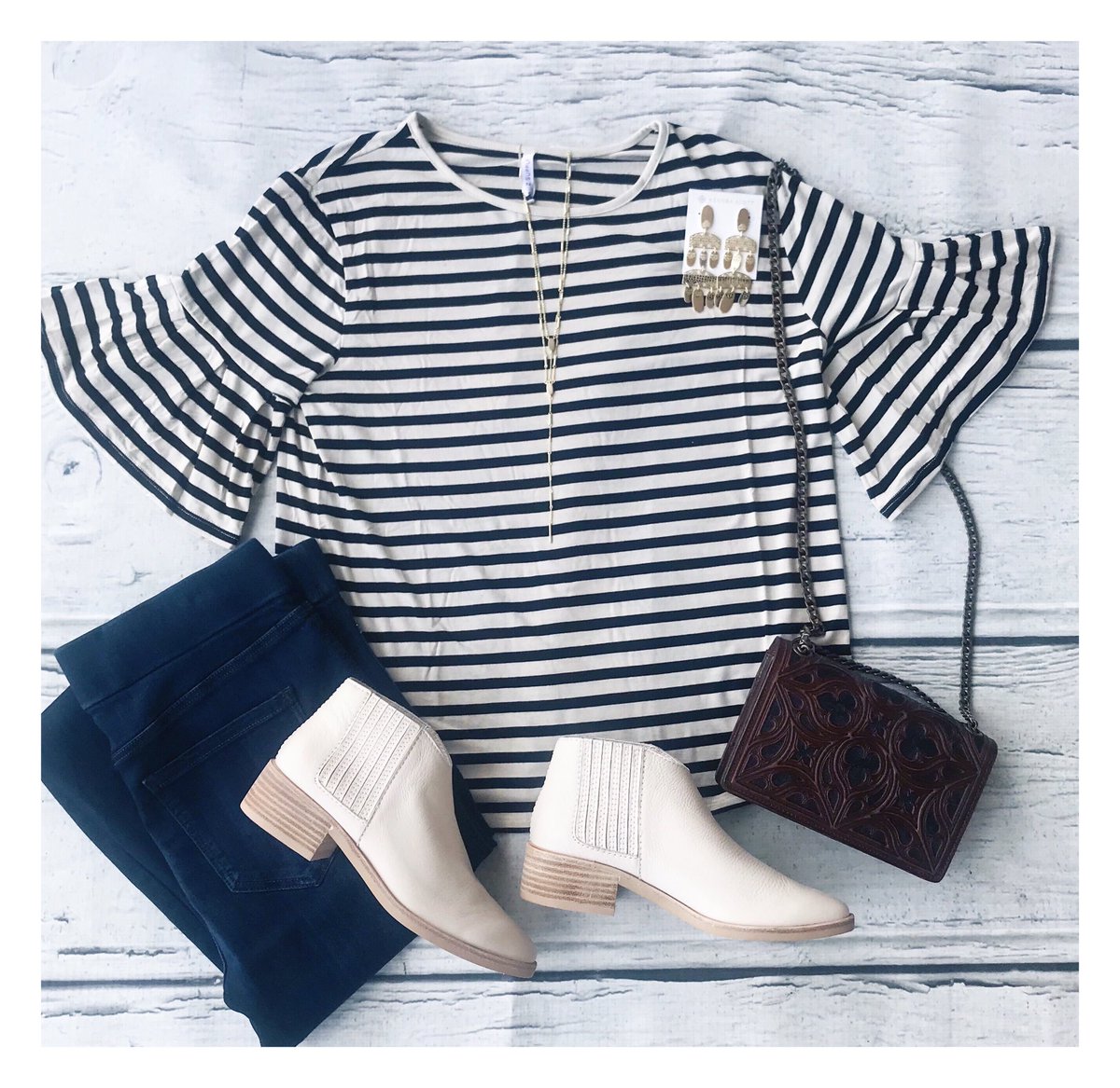 OBSESSED with this ruffled top sleeve by Zsupply✨ &amp; How dreamy are these white booties?! ✨ 
Top : $44 
Booties : $130 💓
#shoplocal #shopjhoffmans #captureyourstyle