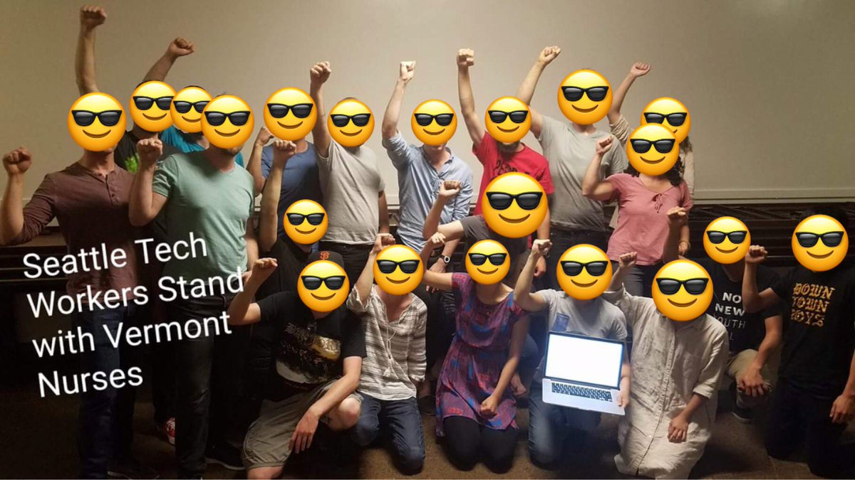 20 Seattle workers raising their fists in a photo captioned "Seattle Tech Workers Stand with Vermont Nurses"