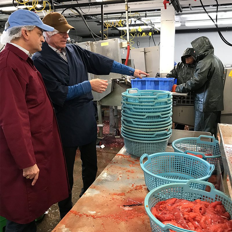 U.S. Secretary of Labor Alexander Acosta touring a fish processing facility in Naknek, Alaska.