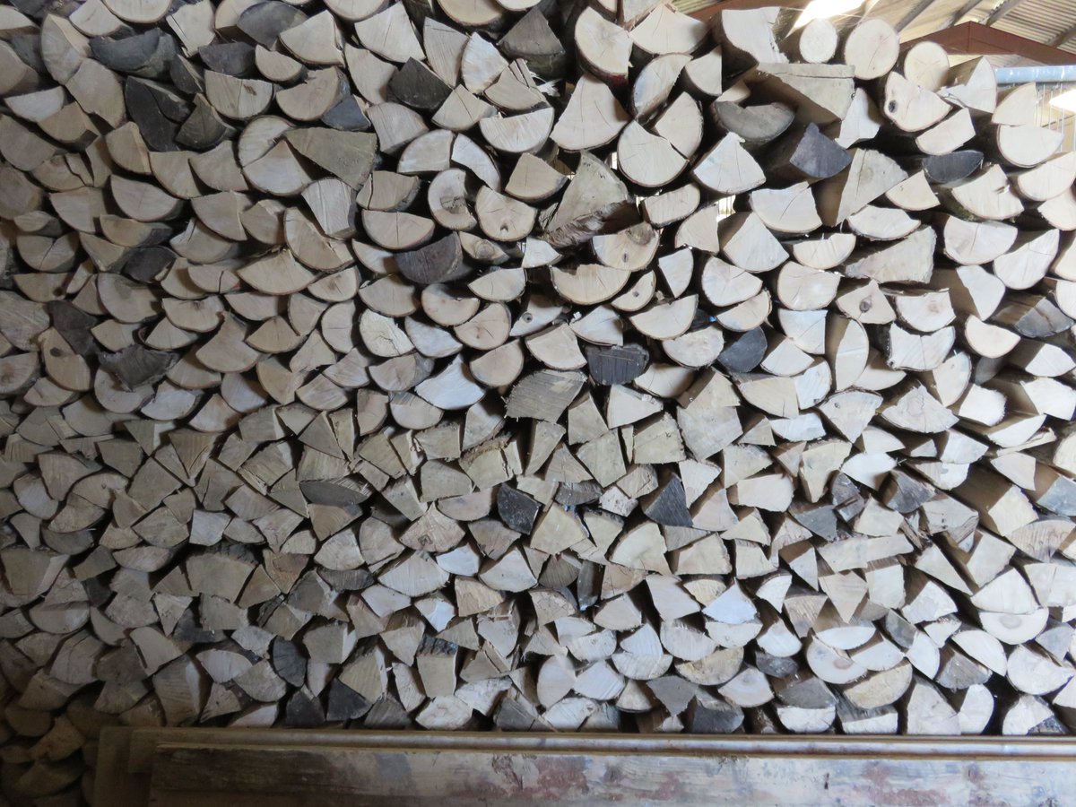 On a weekend off from cooking, what do I do? Stack wood for next year!