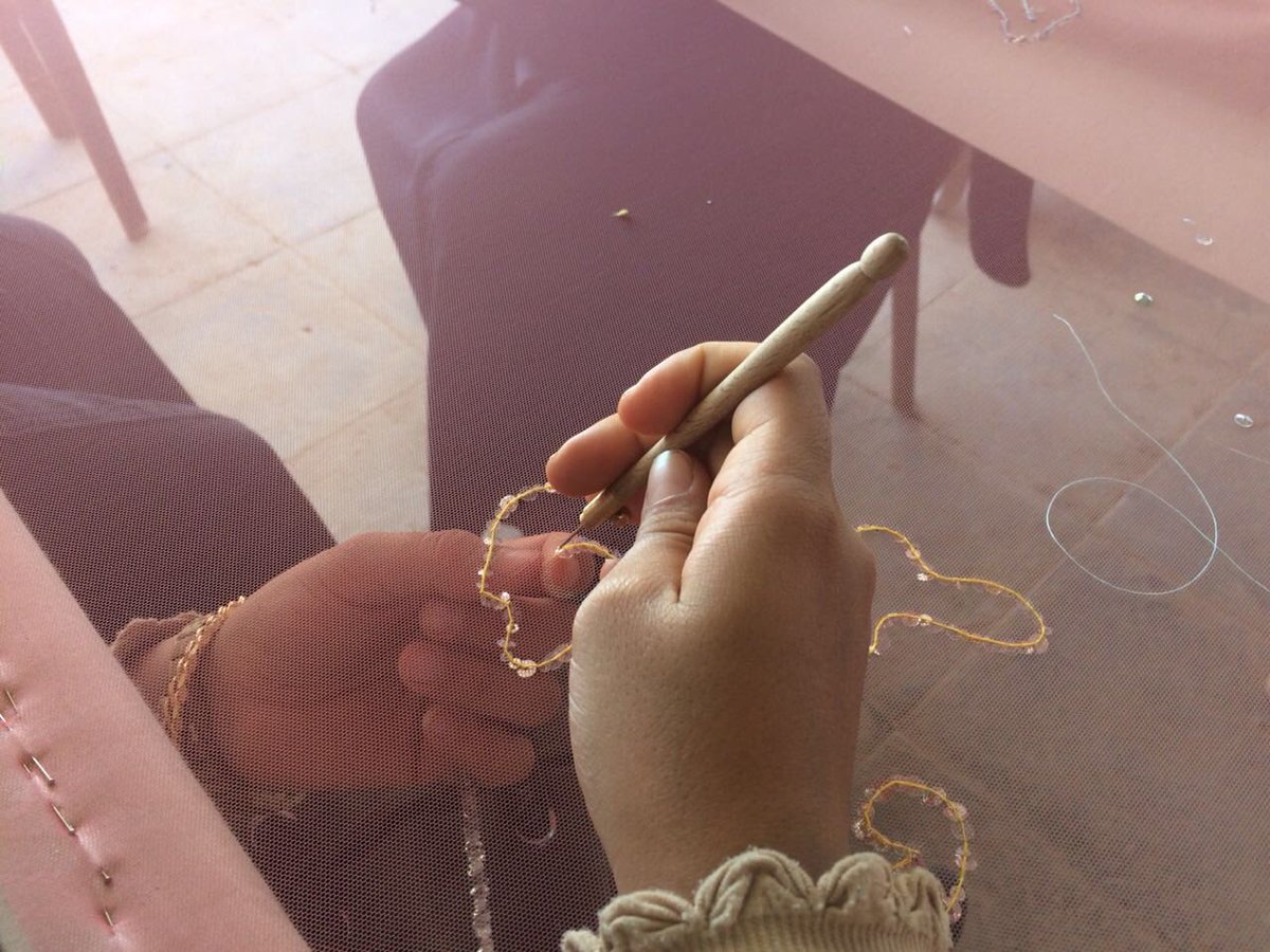 ZaatariCamp's tweet photo. A wonderful collaboration with @eliesaabworld for &amp; with the Tiger Girls &amp; Tiger coaches of @ZaatariCamp &amp; @LCFLondon - The first step to embroider a piece of original beauty - standing together with @Refugees https://t.co/7NeiBMIcQX