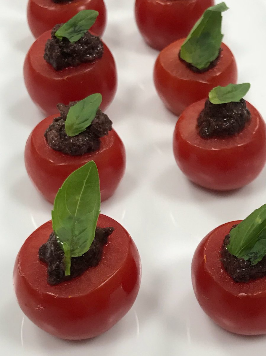 Cherry tomatoes stuffed with black olive tapenade #canapereception #canapes #catering #instafood