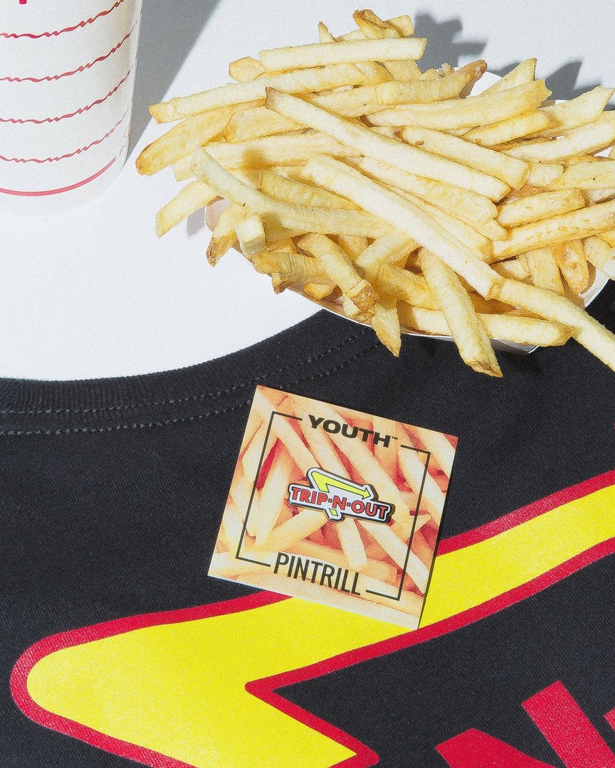 Our latest collab with <a href="/pintrill/">PINTRILL</a> is now live. Grab the tee on youthmachine.com and the pin on pintrill.com while supplies last.