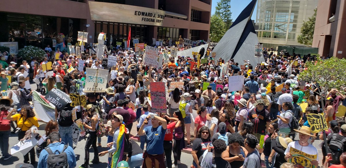 CAFastFoodUnion's tweet photo. THOUSANDS of marchers join clergy as they block the entrance of ICE in San Diego #FreeOurFuture #stopstreamline #ShutDownSessions #FightFor15 https://t.co/Om5YktJy2c