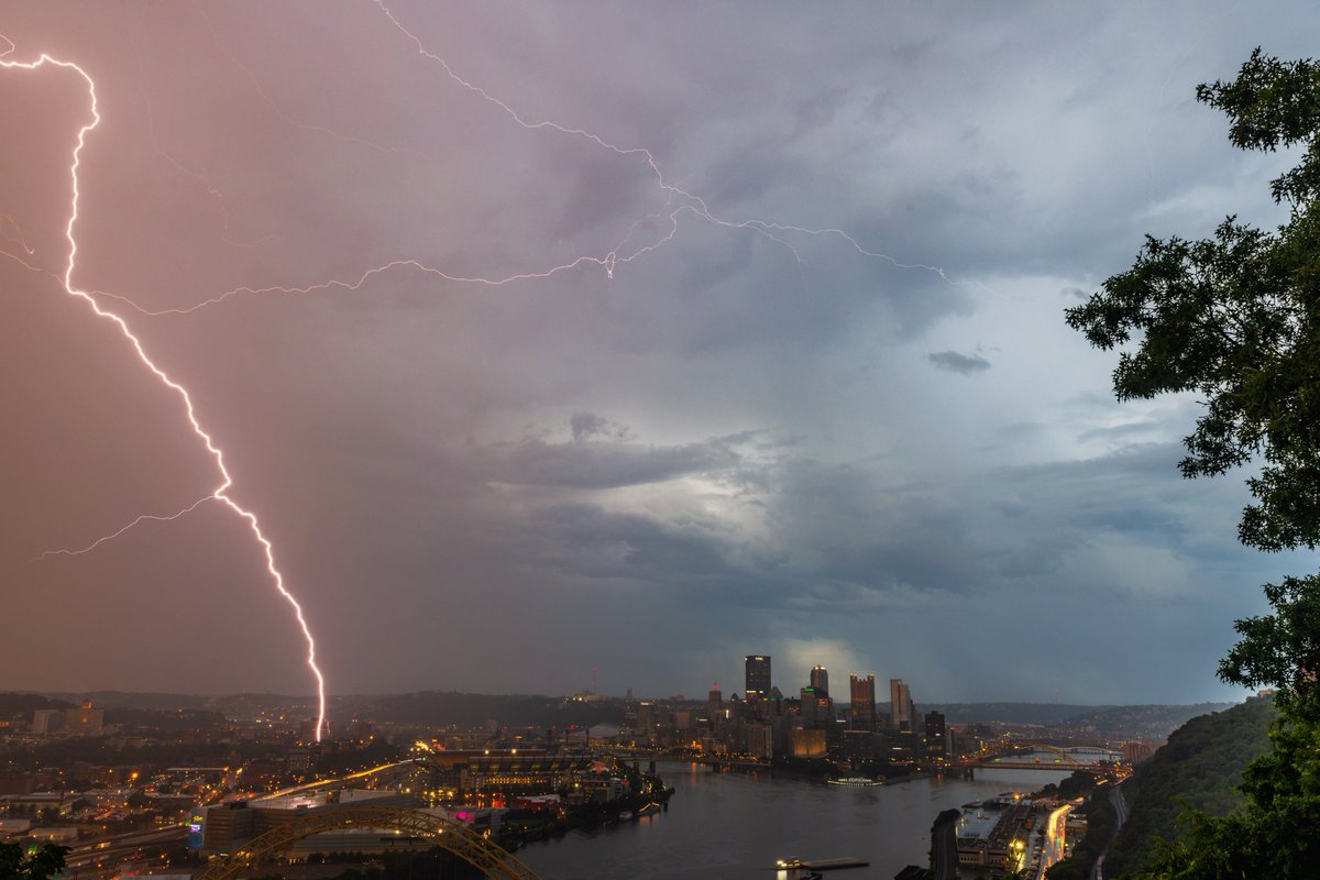 DaveDiCello's tweet photo. Tonight ended up turning out pretty awesome: a towering lightning bolt strikes the North Side of #Pittsburgh this evening, illuminating the falling rain an eerie purple glow just before sunset. Many more to come, so stay tuned. https://t.co/uxjYA0QPzS