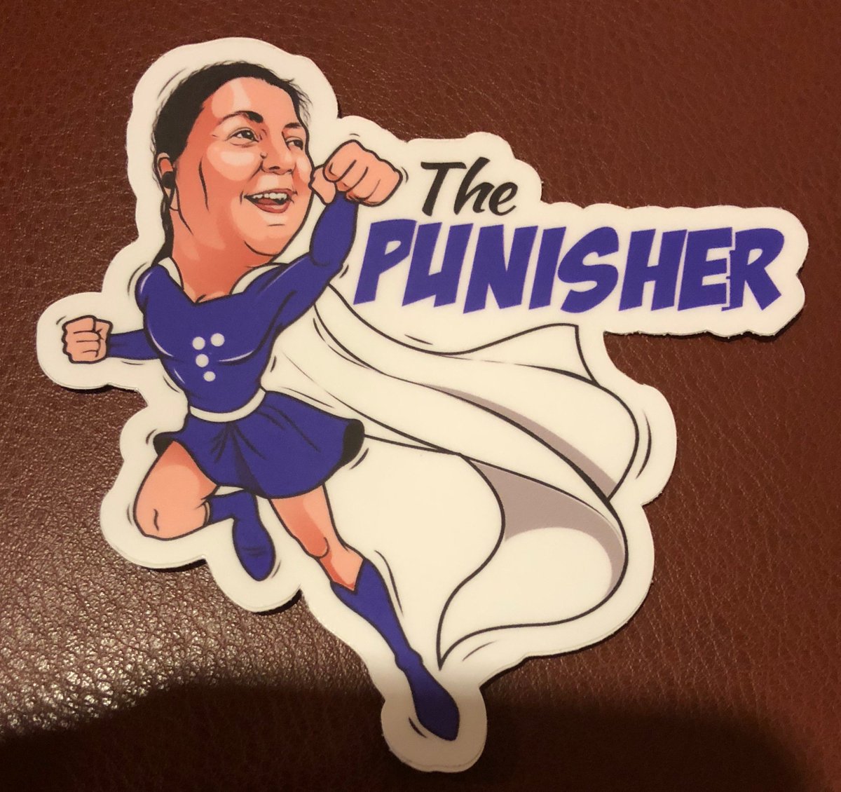 I had dinner with Ted Drake last night. He gave me this awesome sticker portraying Lucy Greco as a superhero called, “The Punisher”. There’s a Braille character “P” on the front of her purple costume. Lucy is certainly an #accessibility superhero!! #a11y