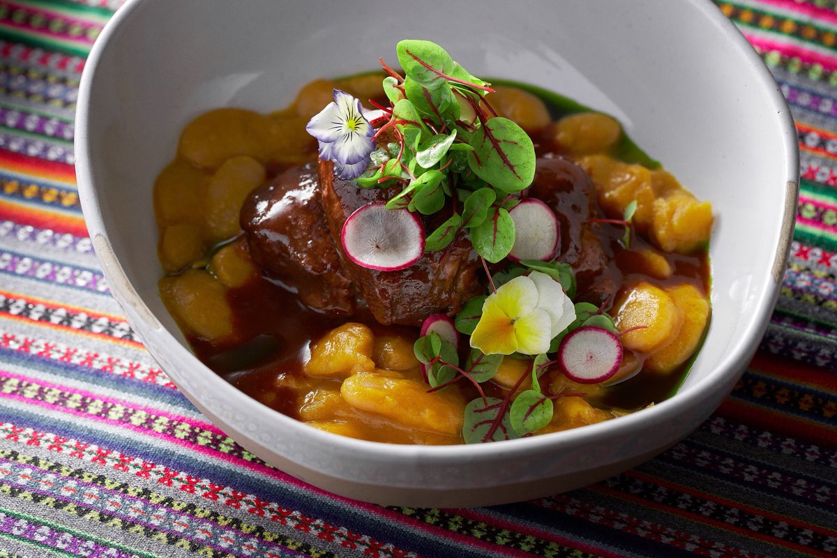 diegooka's tweet image. Veal cheeks asado, chicha de jora, aji  panca, chicha morada over creamy lima beans. #LaMarMiami