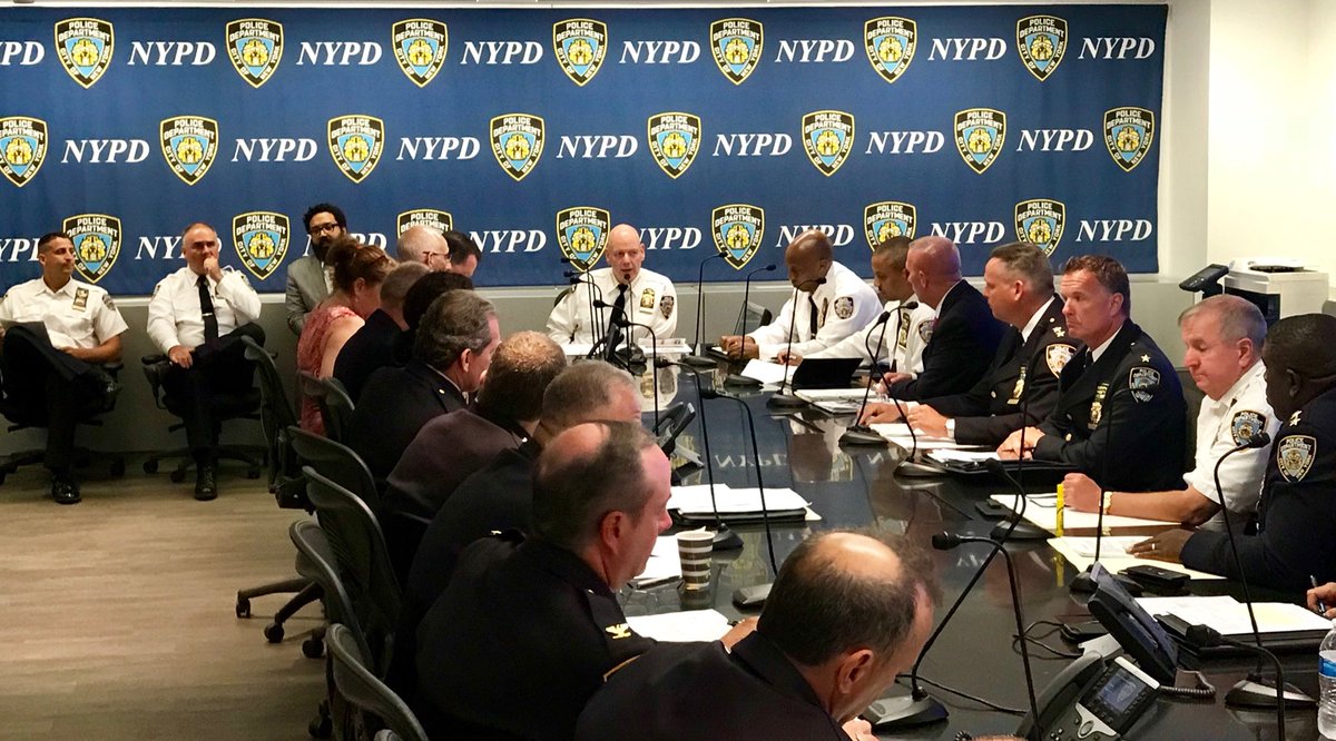 NYPD staff around conference table