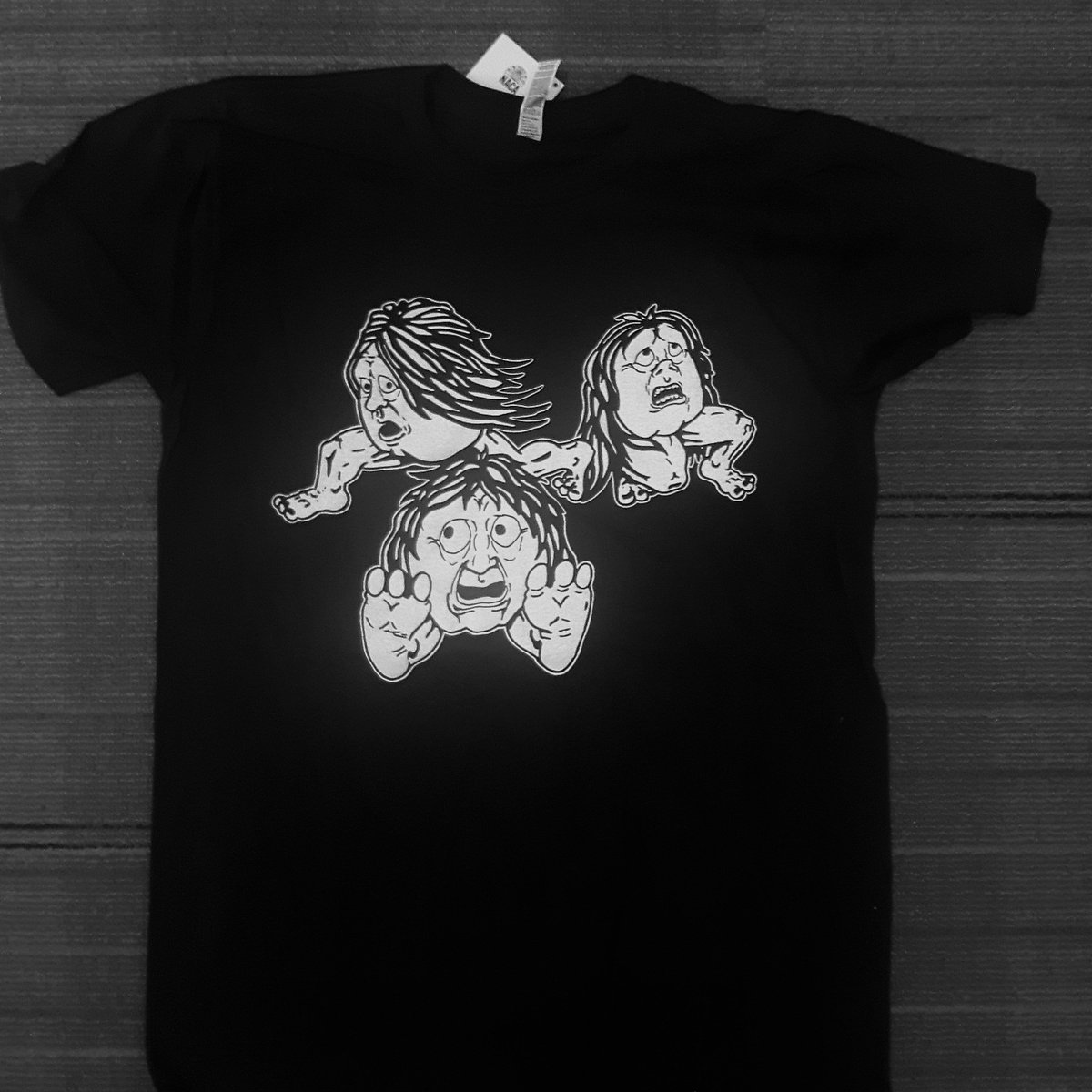 Our festival t-shirts are in! Be sure to pick yours up during the #NunavutArtsFestival, July 4 to 9. The shirt features Inuk artist Babah Kalluk's rendition of the Inuit myth characters, "Katutajuk," often shown with genitalia on their cheeks/chin, but Babah's version is PG :)