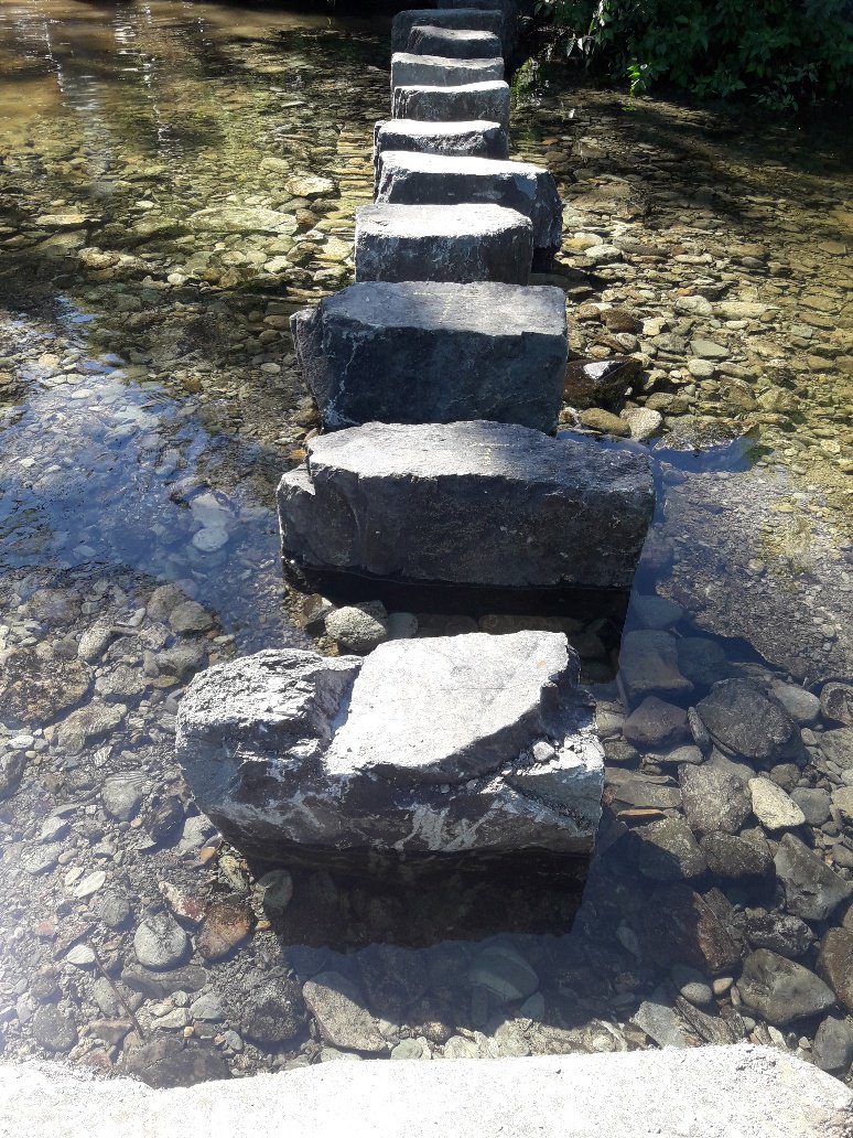 LakesRangers's tweet photo. Rydal Stepping Stones repairs completed by our #routestoresilience project. Stones re-instated by setting in concrete slabs off-site and the craning in. Minimised disturbance to the beck, and landscaped in with surrounding rock and gravel to hide the concrete. https://t.co/Tw2g1ch4iV