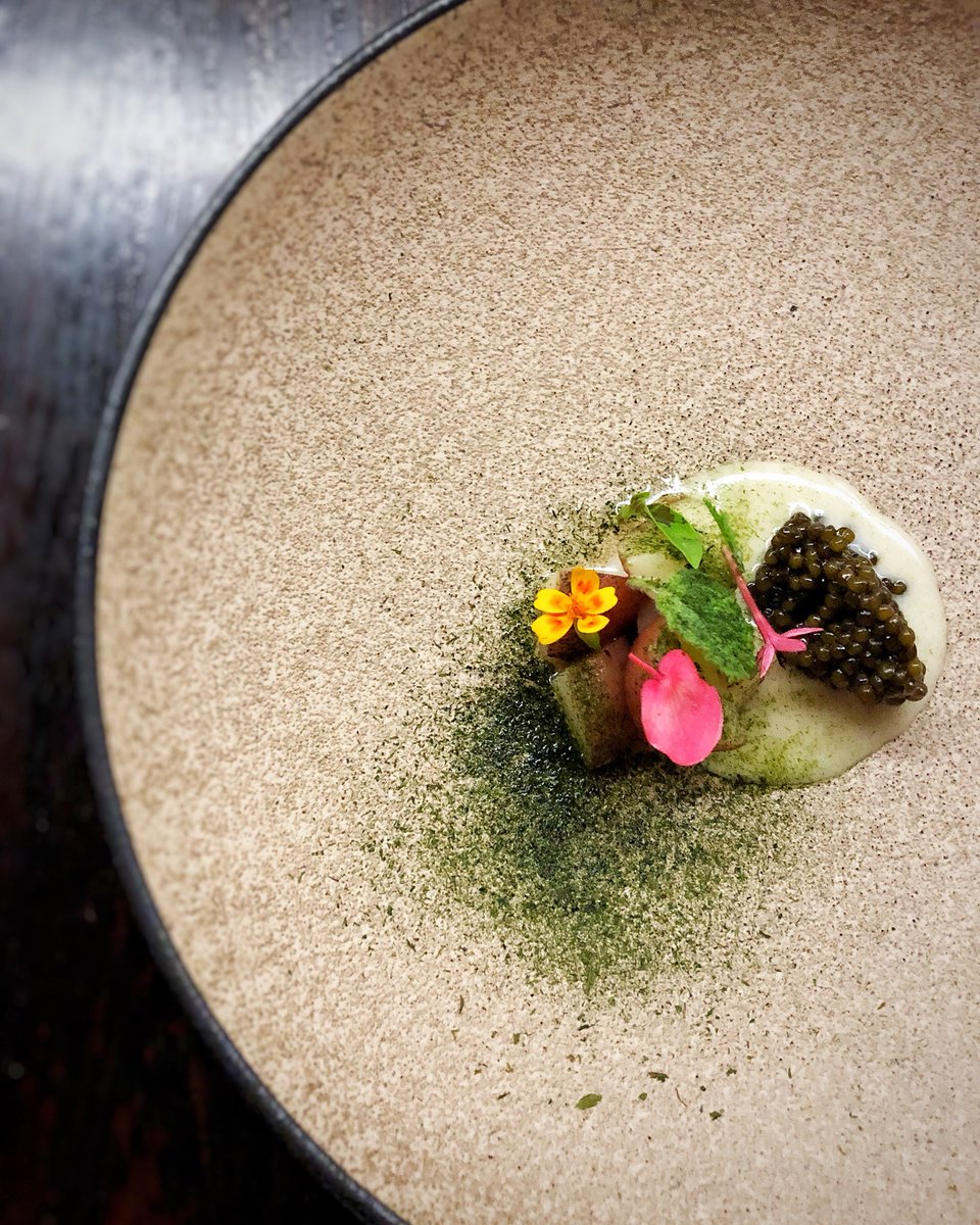 Smoked marble potatoes with Russian Osetra caviar, fermented butter and spring herbs