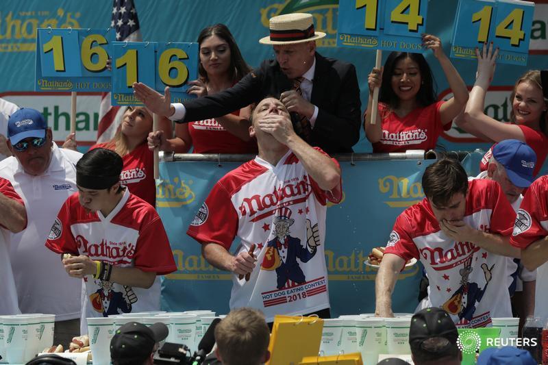 Joey Chestnut wins the annual Nathan's Hot Dog Eating Contest, setting a new world record by eating 74 hot dogs in Brooklyn, New York City
