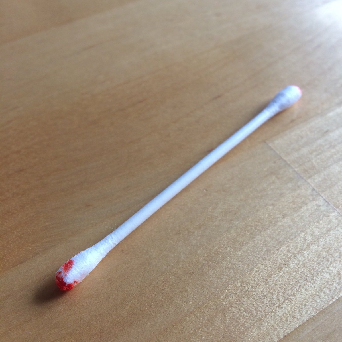 Cotton bud with what looks like blood on it. (It’s not)