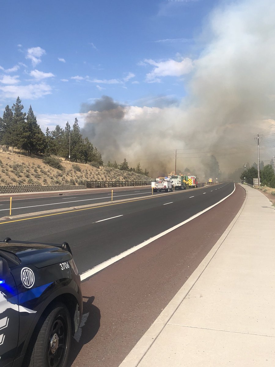 BendCityPolice's tweet photo. There is a brush fire on the south side of Pilot Butte. Highway 20 is closed and the apartments next to the butte are being evacuated. Please avoid the area. https://t.co/dP7IZfSLKK